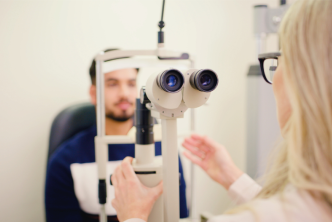 A healthcare provider examines a patient for geographic atrophy